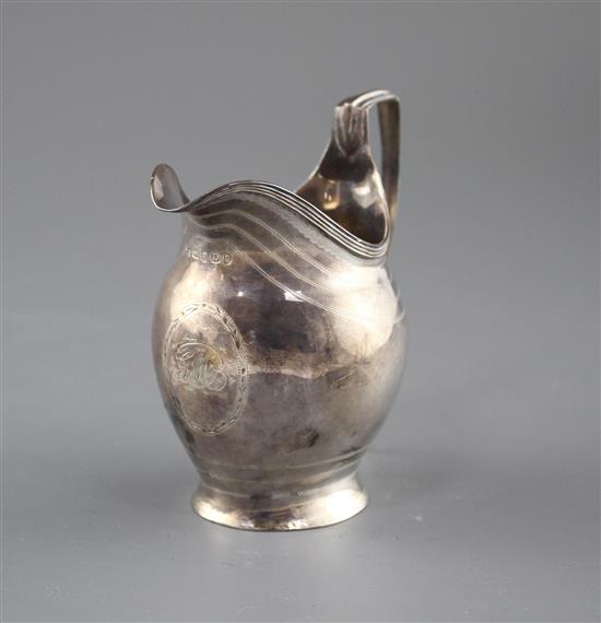 A George III engraved silver helmet shaped cream jug by George Burrows, London, 1799, height 11cm, 3.5oz.